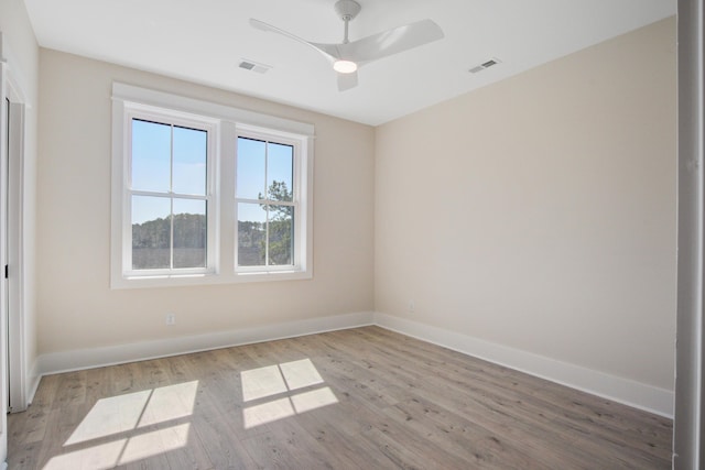 unfurnished room featuring light hardwood / wood-style flooring and ceiling fan