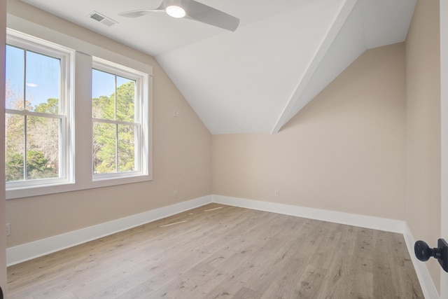 additional living space with ceiling fan, light wood-type flooring, and lofted ceiling