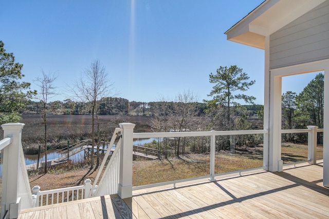 wooden deck with a water view