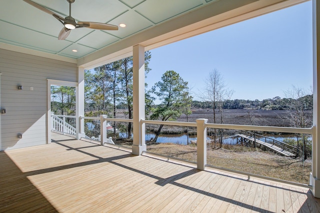 exterior space featuring a water view and ceiling fan