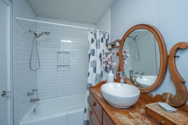 bathroom with vanity, a textured ceiling, and shower / bath combo with shower curtain