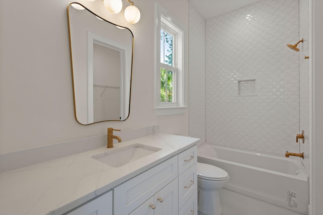 bathroom with shower / bathing tub combination, toilet, and vanity