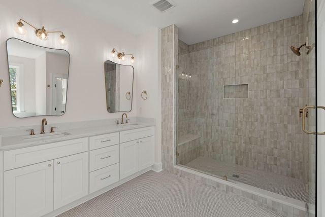 full bathroom with visible vents, a sink, tile patterned floors, and a stall shower
