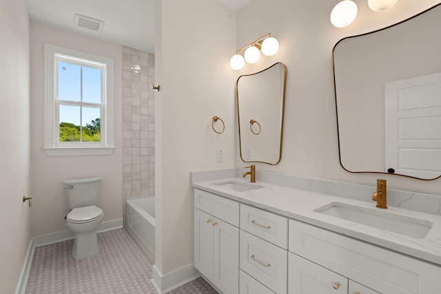 full bath featuring double vanity, visible vents, toilet, and a sink