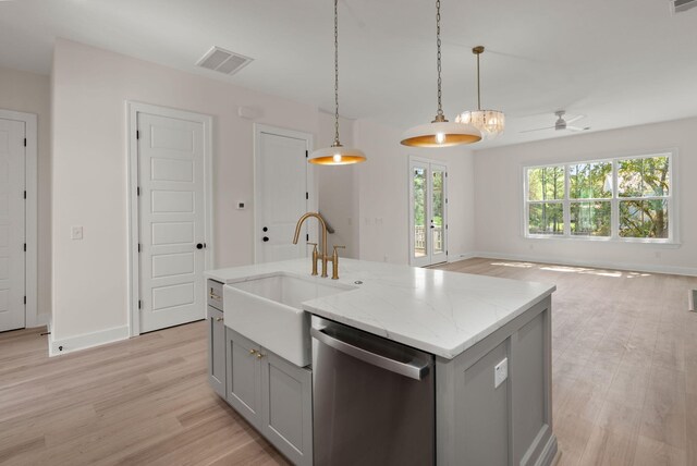 kitchen featuring gray cabinets, a sink, a ceiling fan, dishwasher, and open floor plan
