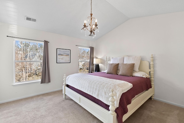 carpeted bedroom featuring vaulted ceiling and a notable chandelier