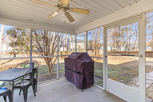 sunroom featuring a wealth of natural light and ceiling fan