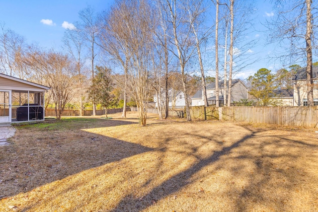 view of yard with a sunroom