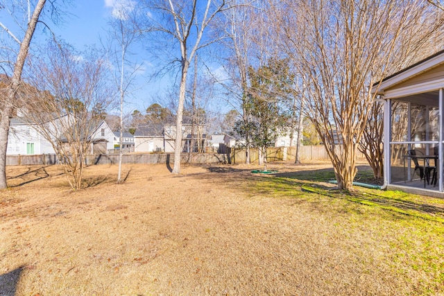 view of yard featuring a sunroom