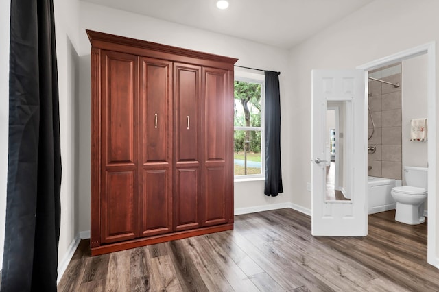 5233 Maybank Hwy, Wadmalaw Island, SC 29487 - unfurnished bedroom featuring wood finished floors, baseboards, and ensuite bathroom