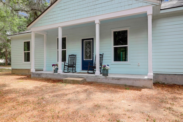 5233 Maybank Hwy, Wadmalaw Island, SC 29487 - doorway to property featuring covered porch