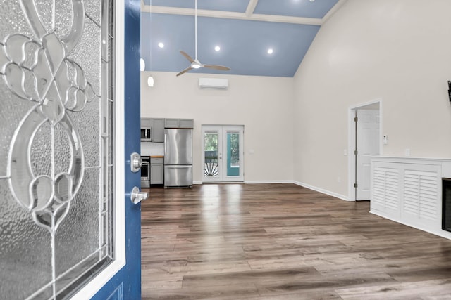 5233 Maybank Hwy, Wadmalaw Island, SC 29487 - entryway featuring high vaulted ceiling, a ceiling fan, dark wood-type flooring, baseboards, and a wall mounted AC