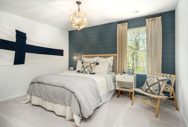 bedroom with baseboards, carpet flooring, visible vents, and a notable chandelier