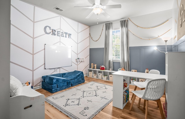 153 Glory Rd, Beaufort, SC 29906 - rec room with a decorative wall, ceiling fan, wood finished floors, and wainscoting