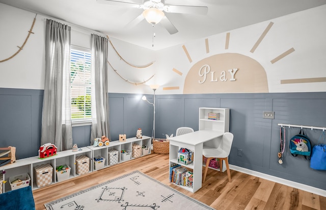 153 Glory Rd, Beaufort, SC 29906 - playroom with a decorative wall, a ceiling fan, wood finished floors, and a wainscoted wall