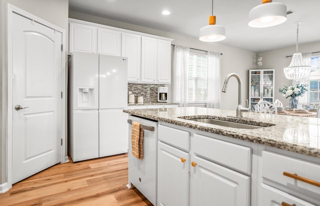 153 Glory Rd, Beaufort, SC 29906 - kitchen featuring white appliances, light wood-style flooring, white cabinets, hanging light fixtures, and recessed lighting