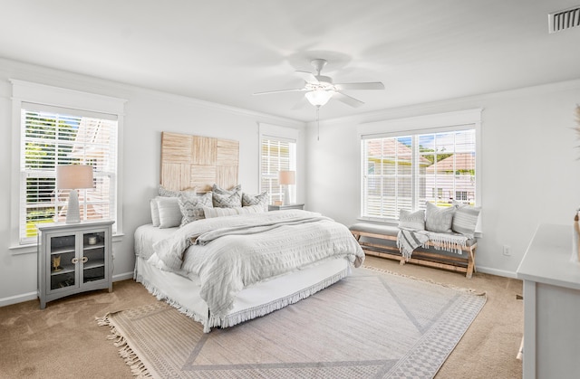 153 Glory Rd, Beaufort, SC 29906 - bedroom with carpet, multiple windows, crown molding, and a ceiling fan