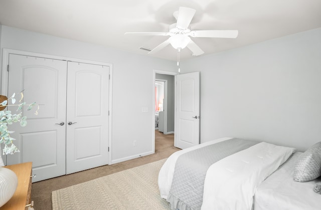 153 Glory Rd, Beaufort, SC 29906 - bedroom with light colored carpet, a closet, and ceiling fan