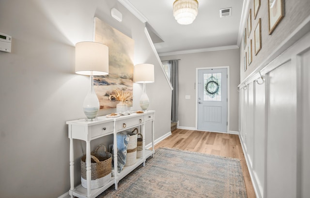 153 Glory Rd, Beaufort, SC 29906 - foyer with light wood finished floors and ornamental molding