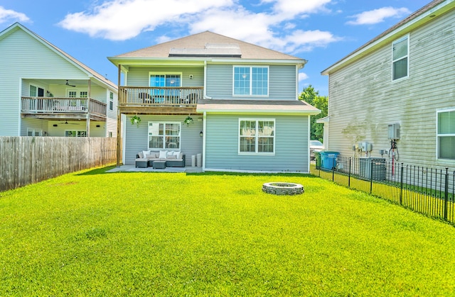 153 Glory Rd, Beaufort, SC 29906 - back of house with an outdoor living space with a fire pit, a ceiling fan, a fenced backyard, and a balcony