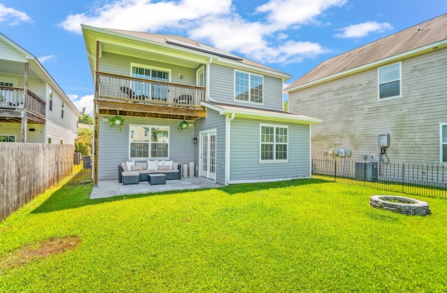 153 Glory Rd, Beaufort, SC 29906 - rear view of property featuring an outdoor living space with a fire pit, a balcony, a fenced backyard, and a patio area