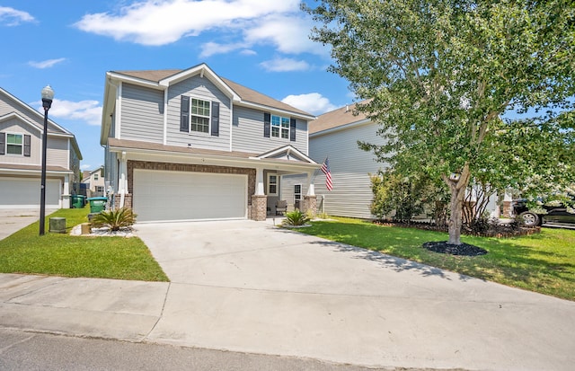 153 Glory Rd, Beaufort, SC 29906 - view of front of home with a garage, a front lawn, brick siding, and driveway