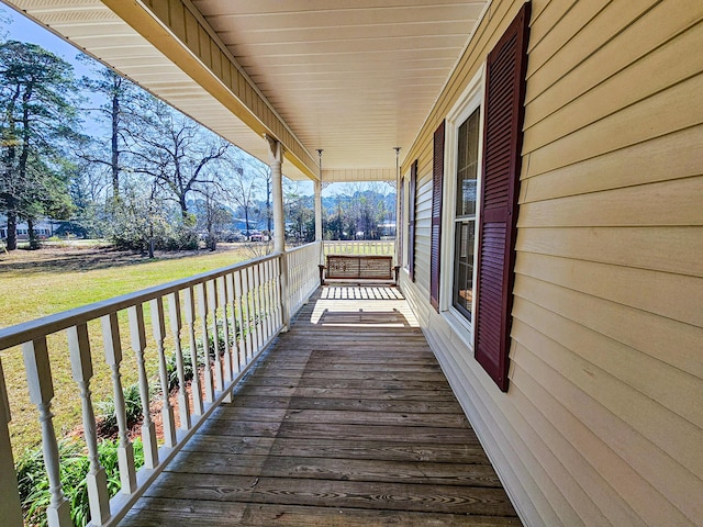 wooden deck featuring a porch