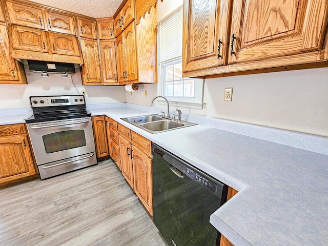 kitchen featuring light wood-type flooring, a sink, stainless steel electric stove, light countertops, and dishwasher