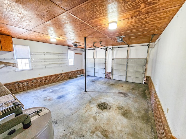 garage featuring wood ceiling and a garage door opener