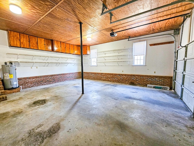 garage featuring electric water heater and a garage door opener