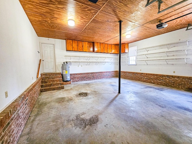 garage featuring wooden ceiling and electric water heater