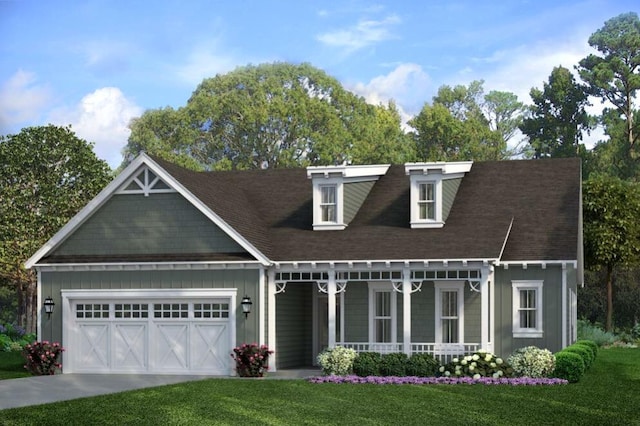 view of front facade with a garage, covered porch, and a front yard