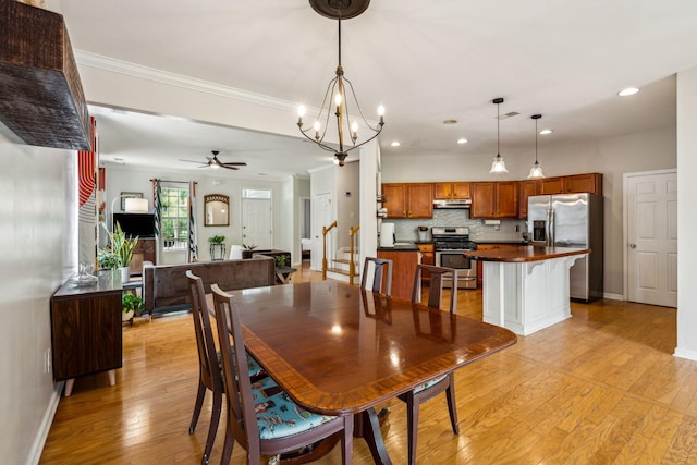 dining area featuring light wood finished floors, baseboards, a chandelier, recessed lighting, and a ceiling fan