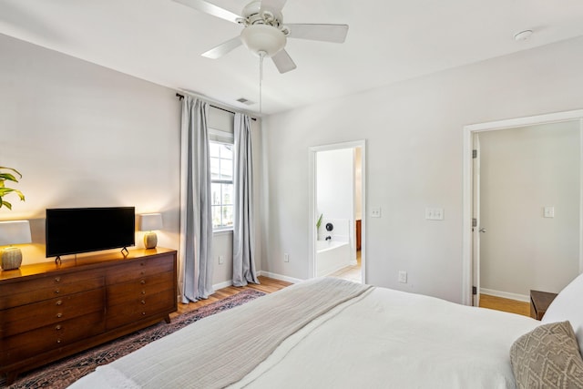 bedroom with wood finished floors, baseboards, and ceiling fan