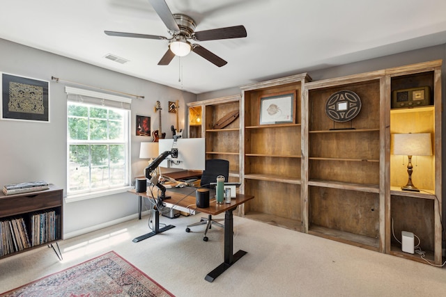 home office with ceiling fan, carpet floors, and baseboards