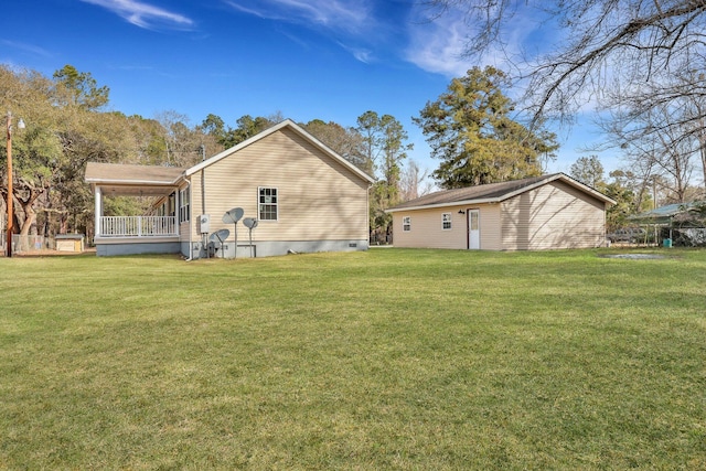 rear view of house with a lawn