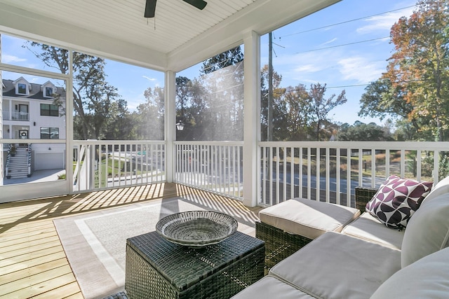 sunroom with ceiling fan