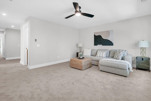 living room with light carpet and ceiling fan