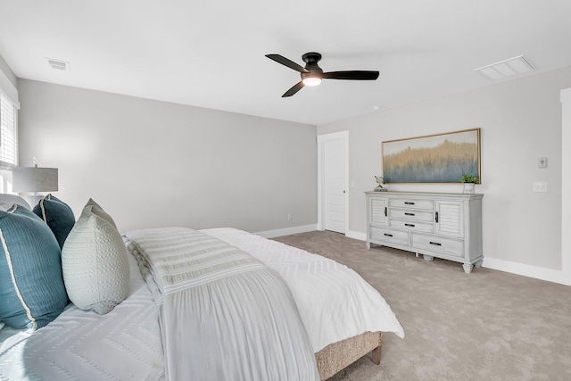 bedroom featuring light colored carpet and ceiling fan