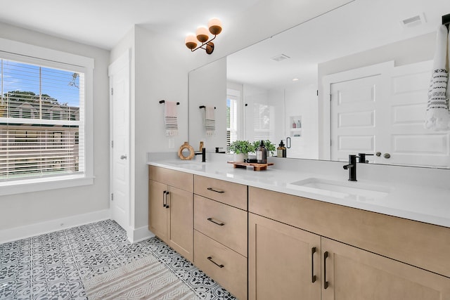 bathroom with vanity, tile patterned floors, and walk in shower