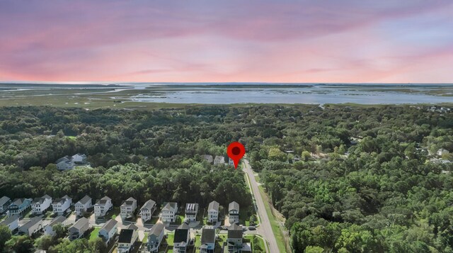 aerial view at dusk with a water view