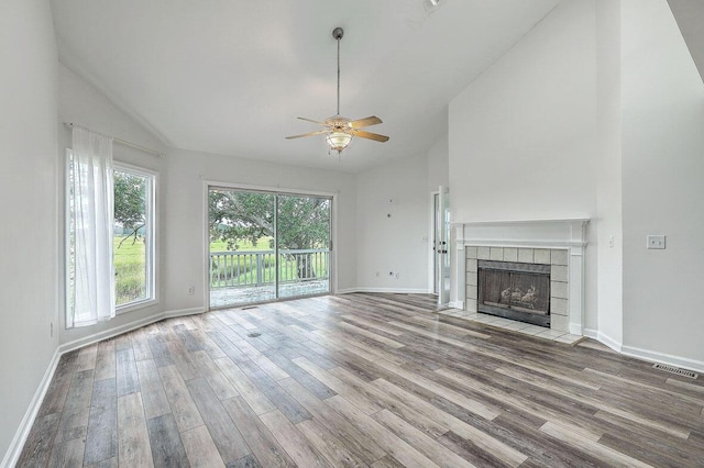 638 Harbor Creek Pl Unit 19, Charleston, SC 29412 - unfurnished living room featuring ceiling fan, wood finished floors, a tile fireplace, and high vaulted ceiling