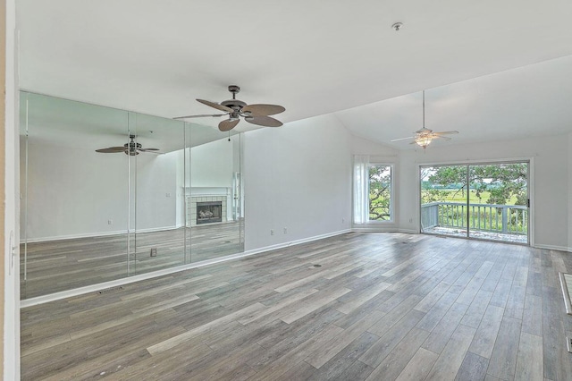 638 Harbor Creek Pl Unit 19, Charleston, SC 29412 - unfurnished living room featuring a ceiling fan, lofted ceiling, wood finished floors, and a fireplace
