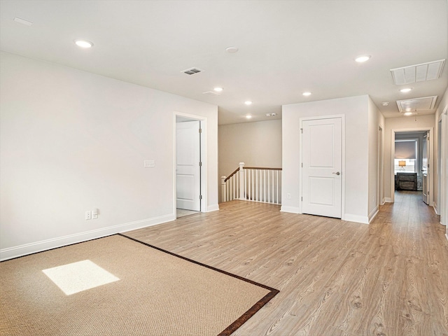 2064 Parish House Cir, Johns Island, SC 29455 - empty room with attic access, visible vents, light wood-style flooring, and baseboards