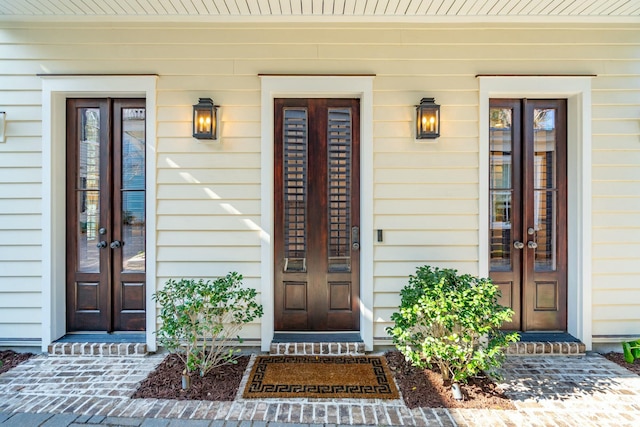 view of exterior entry featuring french doors