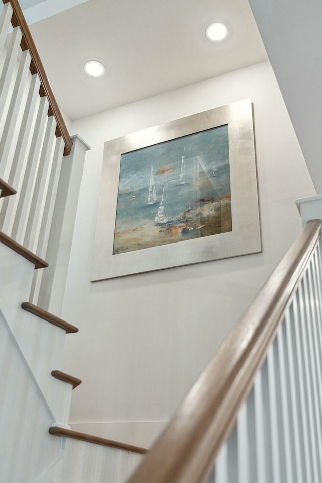 staircase featuring recessed lighting