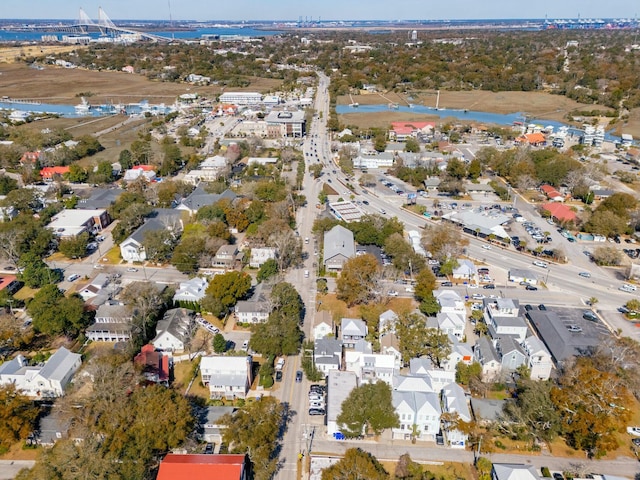 drone / aerial view with a residential view and a water view