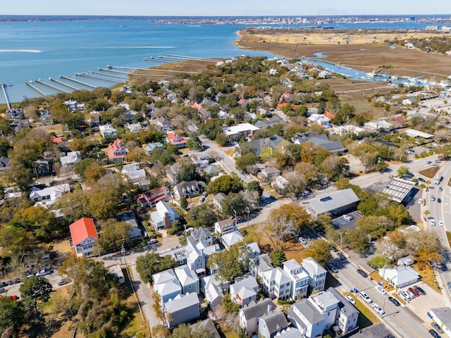 drone / aerial view featuring a water view and a residential view