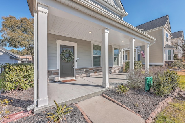 property entrance featuring a porch