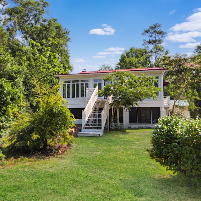 1201 Crescent Dr, Summerton, SC 29148 - rear view of property with stairs, a lawn, a wooden deck, and a sunroom